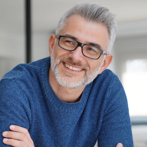 portrait-of-older-smiling-man-with-gray-hair