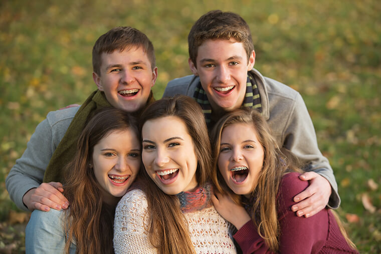 Five Laughing Teens Outdoors