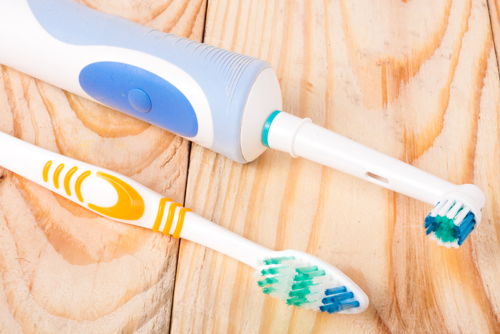 Image of a manual toothbrush and an electric toothbrush.